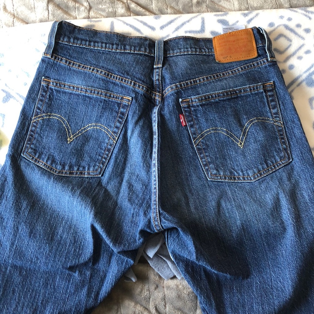Levi’s blue jeans with distressed hem